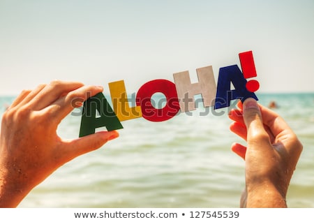 Stok fotoğraf: Female Hand Holding Colorful Word Aloha