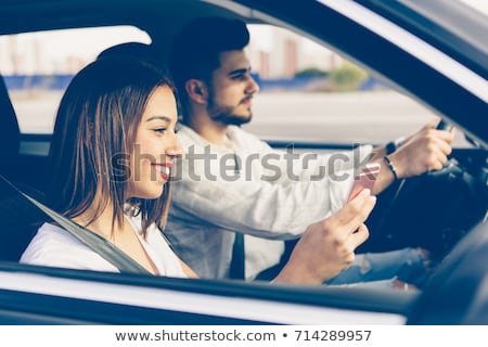 Stok fotoğraf: Image Of Caucasian Woman 20s Using Smartphone While Sitting On