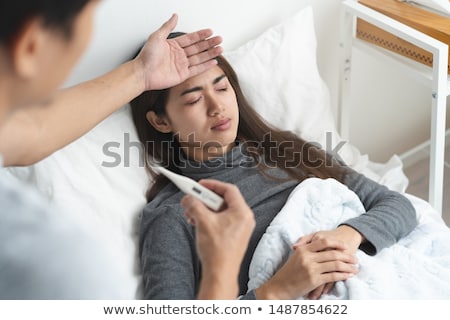 Foto stock: Sick Asian Woman With Thermometer Having Fever