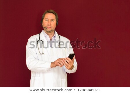 Stockfoto: Medic With Stethoscope And Cellphone