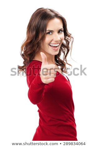 Stok fotoğraf: Happy Young Woman Showing The Thumbs Up Gesture