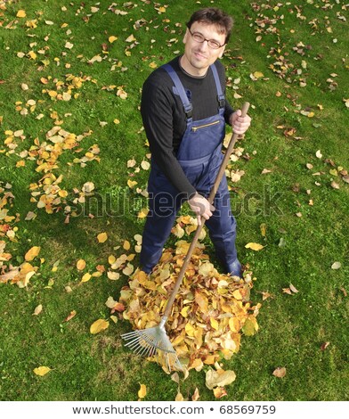 Stockfoto: Man With Rake Looking At Camera