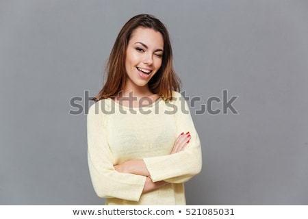 Stock photo: Happy Attractive Casual Girl Standing And Winking