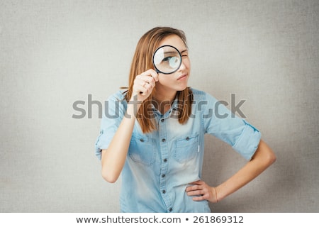 Stock photo: Beautiful Businesswoman Looking Through Magnifying Glass