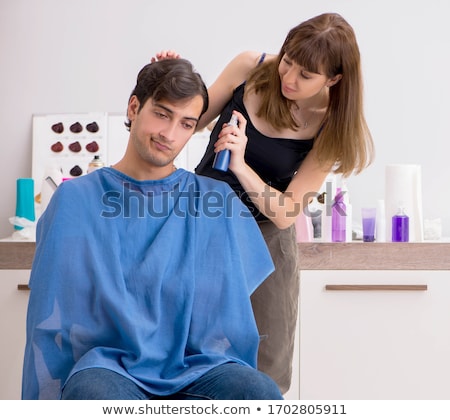 Foto d'archivio: Young Attracrive Man Visiting Female Barber