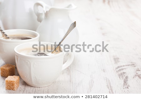 Stock fotó: Cup Of Coffee With Sugar Cubs And Milk Jug