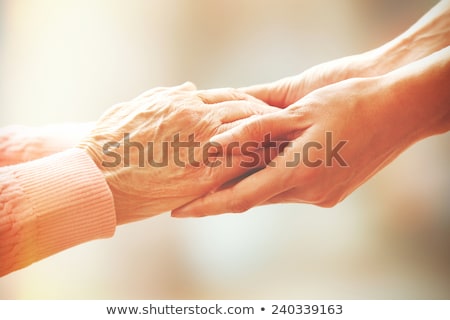 ストックフォト: Hands Of Young And Senior Women - Helping Hand Concept