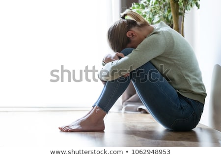 ストックフォト: Sad Woman Crouching On The Floor