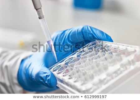 Stok fotoğraf: Researcher Pipetting In Laboratory