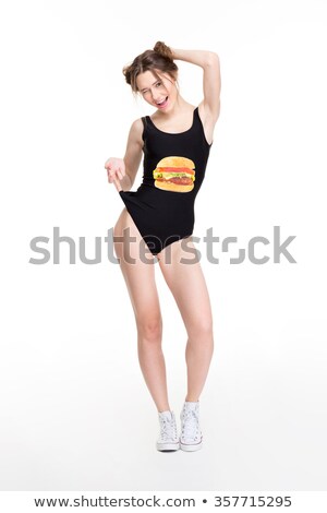 Stock photo: Attractive Slim Young Woman In Black Swimwear And Sneakers