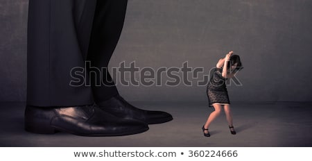 Foto stock: Huge Legs With Small Businesswoman Standing In Front Concept