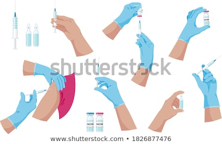 [[stock_photo]]: A Syringe And A Vaccine Bottle