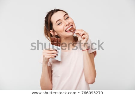 Stok fotoğraf: Woman Eating Chocolate Candy