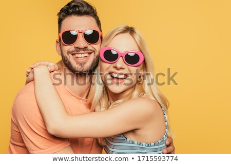 Foto d'archivio: Smiling Couple In Sunglasses Hugging