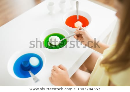 Stock photo: Girl Coloring Easter Eggs By Liquid Dye At Home