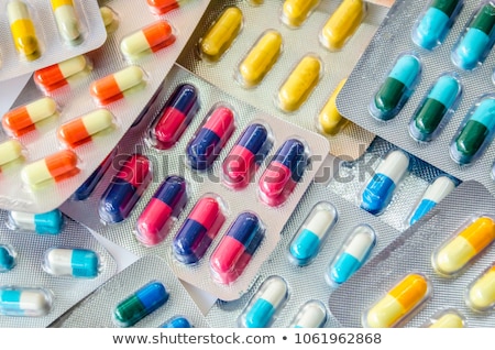 Stockfoto: Pharmacy Antibiotic Pills In Spoon On White Background