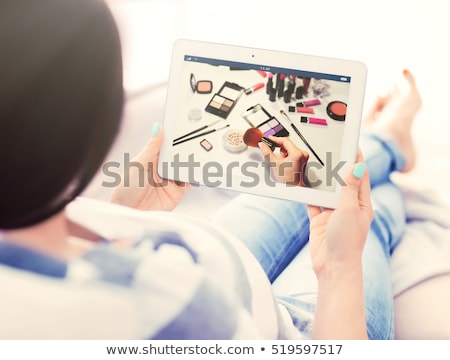 Stok fotoğraf: Woman Makeup With Tablet