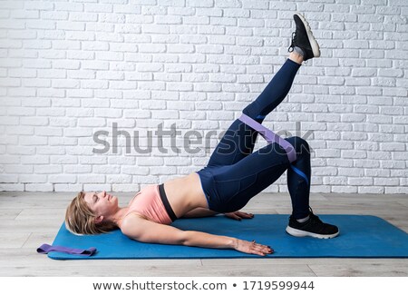 Foto d'archivio: Woman Exercising With Rubber Band