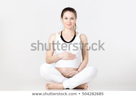 Сток-фото: Smiling Pregnant Woman Doing Stretching Exercise