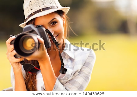 Foto d'archivio: Pretty Female Photographer With Digital Camera