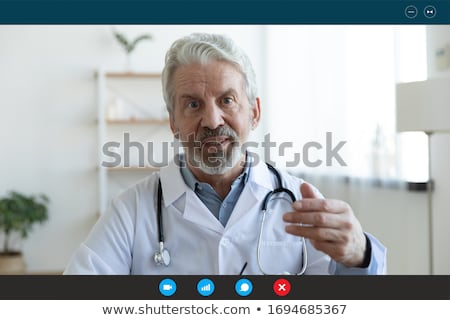 Stock fotó: Man Doctor In Cardiology Telemedicine Concept