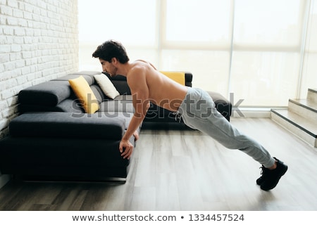 Foto stock: Man Training Chest And Biceps Doing Push Ups With Backward Grip