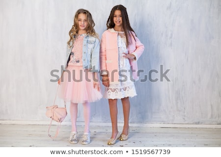 Stok fotoğraf: Two Cheerful Young Girls On On Roller Skates