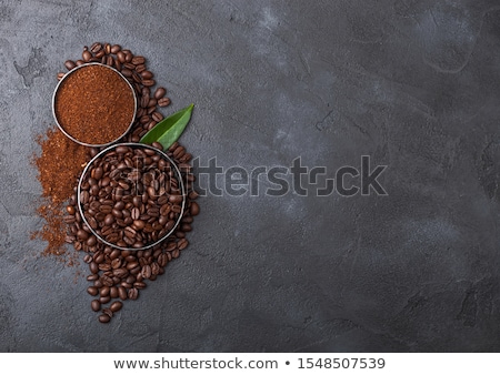 Stockfoto: Fresh Raw Organic Coffee Beans With Ground Powder And Coffee Trea Leaf On Black Background