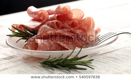 [[stock_photo]]: Slices Of Salami On The Plate