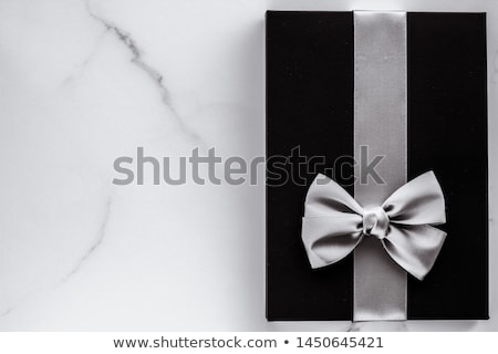 Stock fotó: Black Silk Ribbon And Bow On Marble Background Flatlay