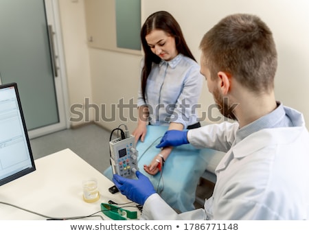 Stok fotoğraf: Doctor And Nervous Patient Examining Ultrasound