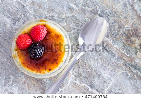 Foto stock: Overhead View Of Silver Spoon On Granite Counter