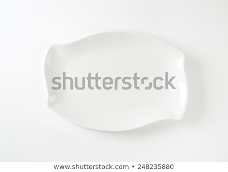 Foto d'archivio: White Wave Shaped Rectangle Plate