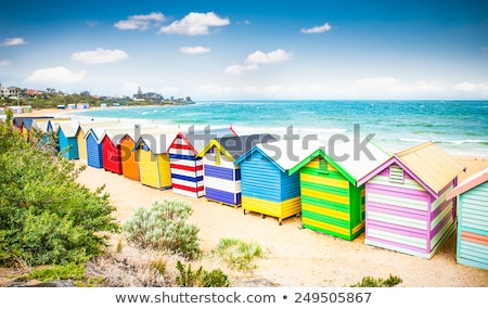 Stok fotoğraf: Multi Colored Beach Hut On Sand