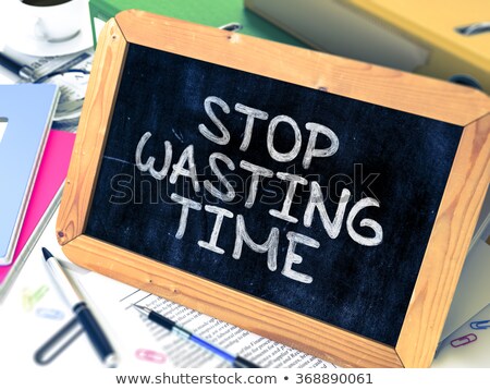 Stockfoto: Stop Wasting Time - Chalkboard With Hand Drawn Text