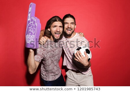 Stockfoto: Portrait Of A Two Young Satisfied Twin Brothers