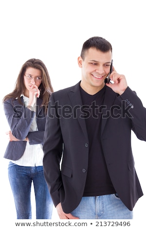 Stok fotoğraf: Jealous Woman Looking At Her Partner Chatting On The Phone