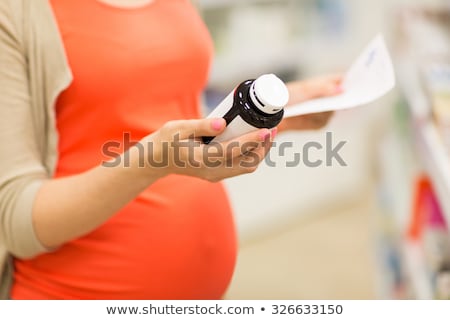 Stock fotó: Happy Pregnant Woman With Medication At Pharmacy