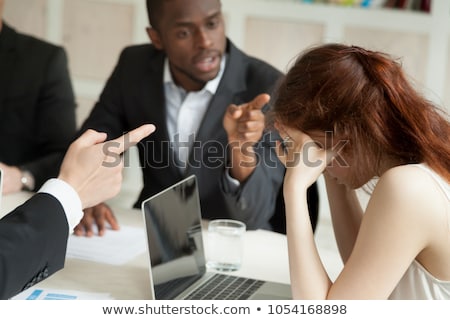 Foto stock: Business Woman Blaming Her Colleague For Mistake In Office