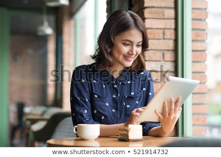 Stock photo: Cute Young Asian Woman Using Laptop