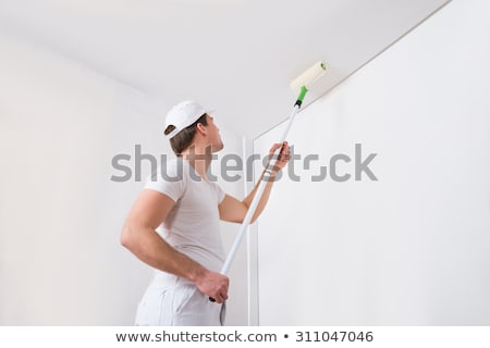 Stock fotó: Man Painting A Ceiling White