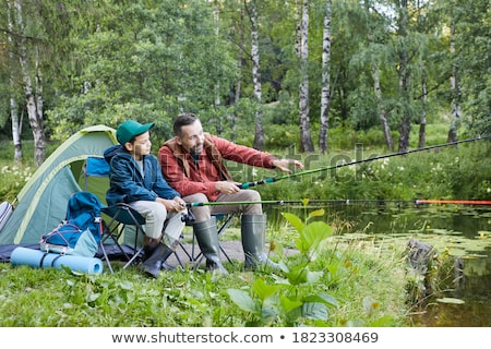 Stok fotoğraf: Father And Son Bonding During Fishing Trip