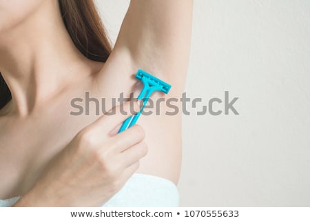 Stockfoto: Woman Shaving Armpit With Razor Isolated