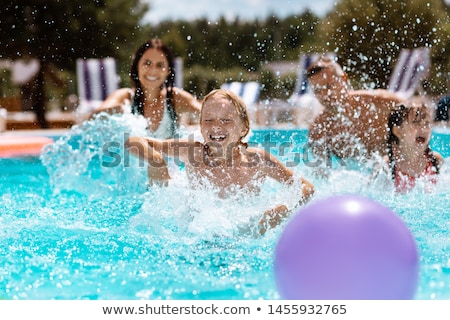 Stock fotó: Happy Child Playing In Swimming Pool