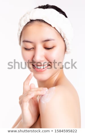 Foto stock: Girl With Cream Smiley Face On Shoulder
