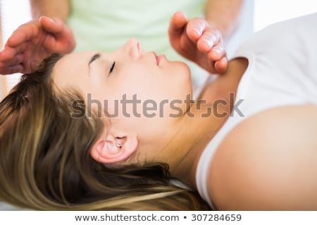 Zdjęcia stock: Relaxed Pregnant Woman Getting Reiki Treatment