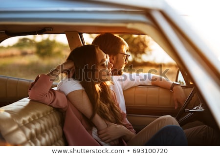 Stock fotó: Loving Couple In The Car Embraces