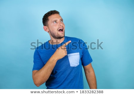 [[stock_photo]]: Portrait Of An Excited Young Bearded Man In T Shirt