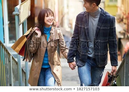 Foto d'archivio: Asian Couple Enjoying Pleasant Walk