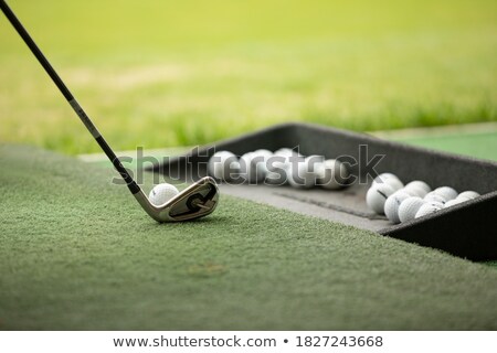 Foto d'archivio: Golf Player On Floor With Balls On Eyes